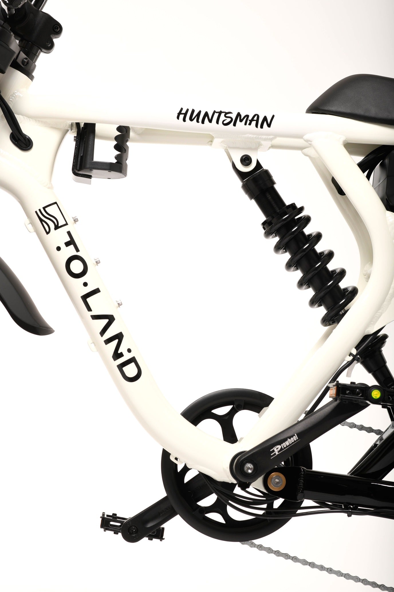 Close-up of a bicycle frame with 'ToLand' and 'Huntsman' branding on a white background.
