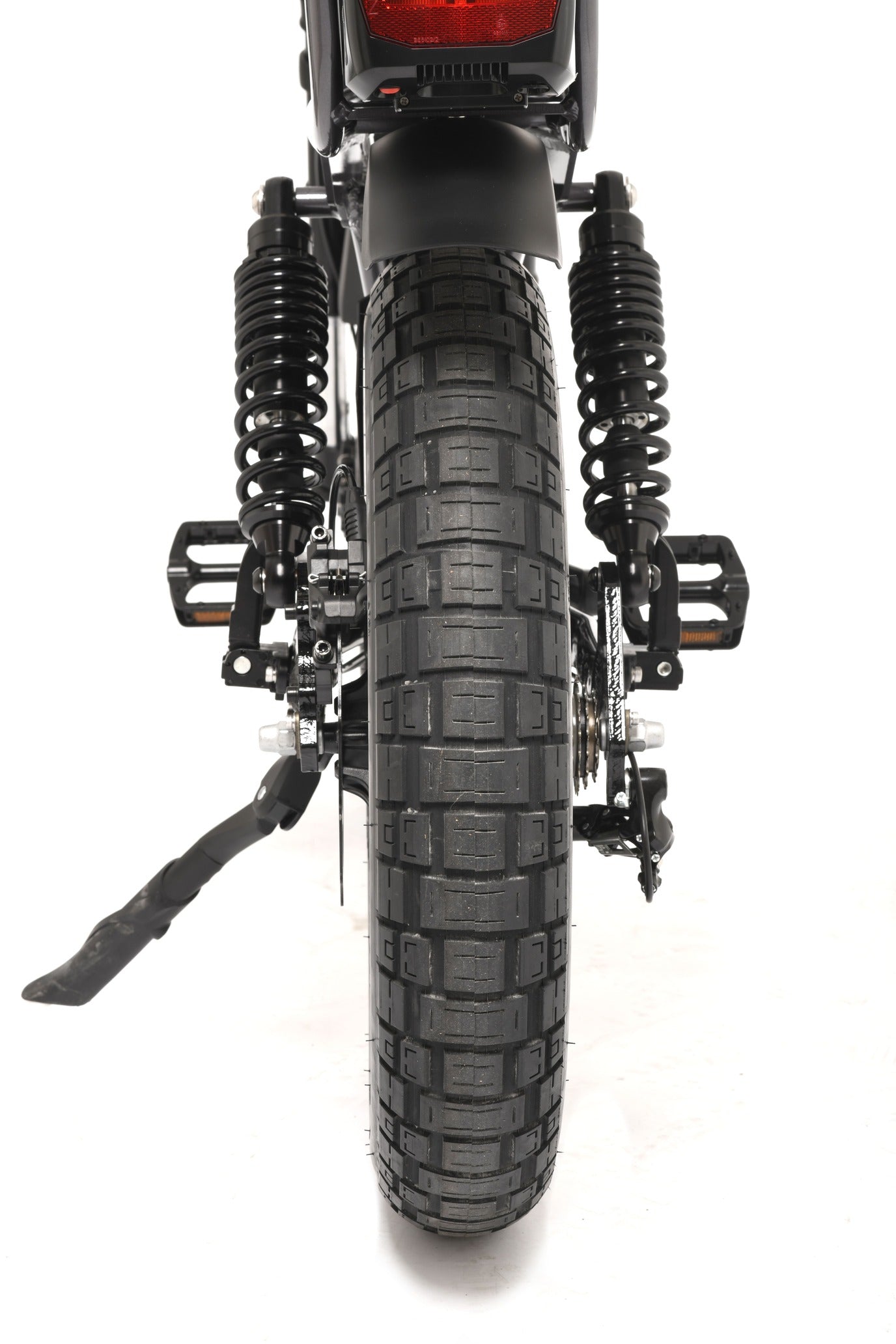 Close-up of a electric bike tyre with suspension on a white background